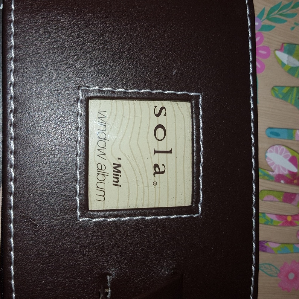 Sola mini photo album.  NEW